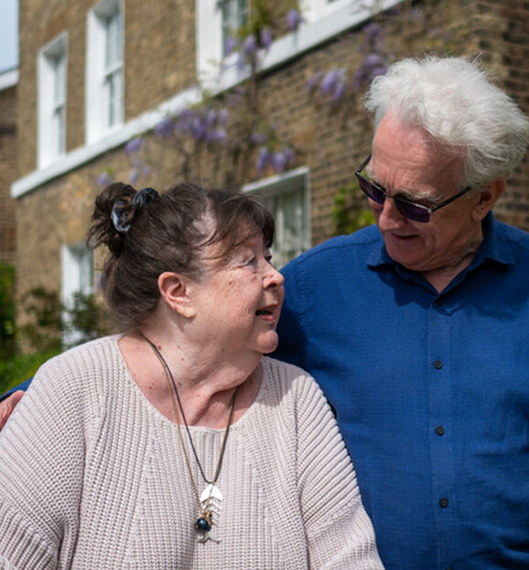 Couple Outside House