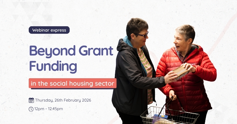 Promotional graphic for a “Webinar Express” titled “Beyond Grant Funding in the social housing sector.” On the right, two people are standing with a shopping basket, passing a loaf of bread between them. On the left, large purple and coral text displays the webinar title and details, including the date “Thursday, 26th February 2026” and time “12pm – 12.45pm,” set against a light neutral background.